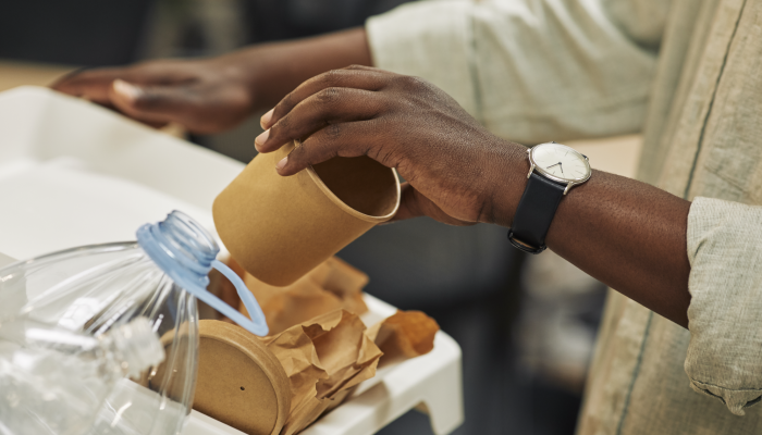 Man Recycling Paper Cup Close Up